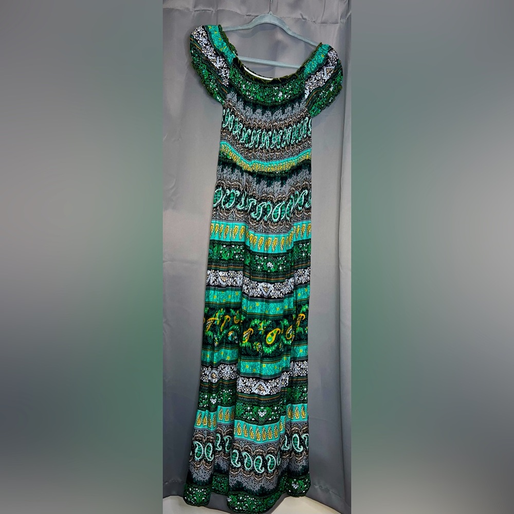 Never worn Long maxi dress. Elastic shoulders for different style.